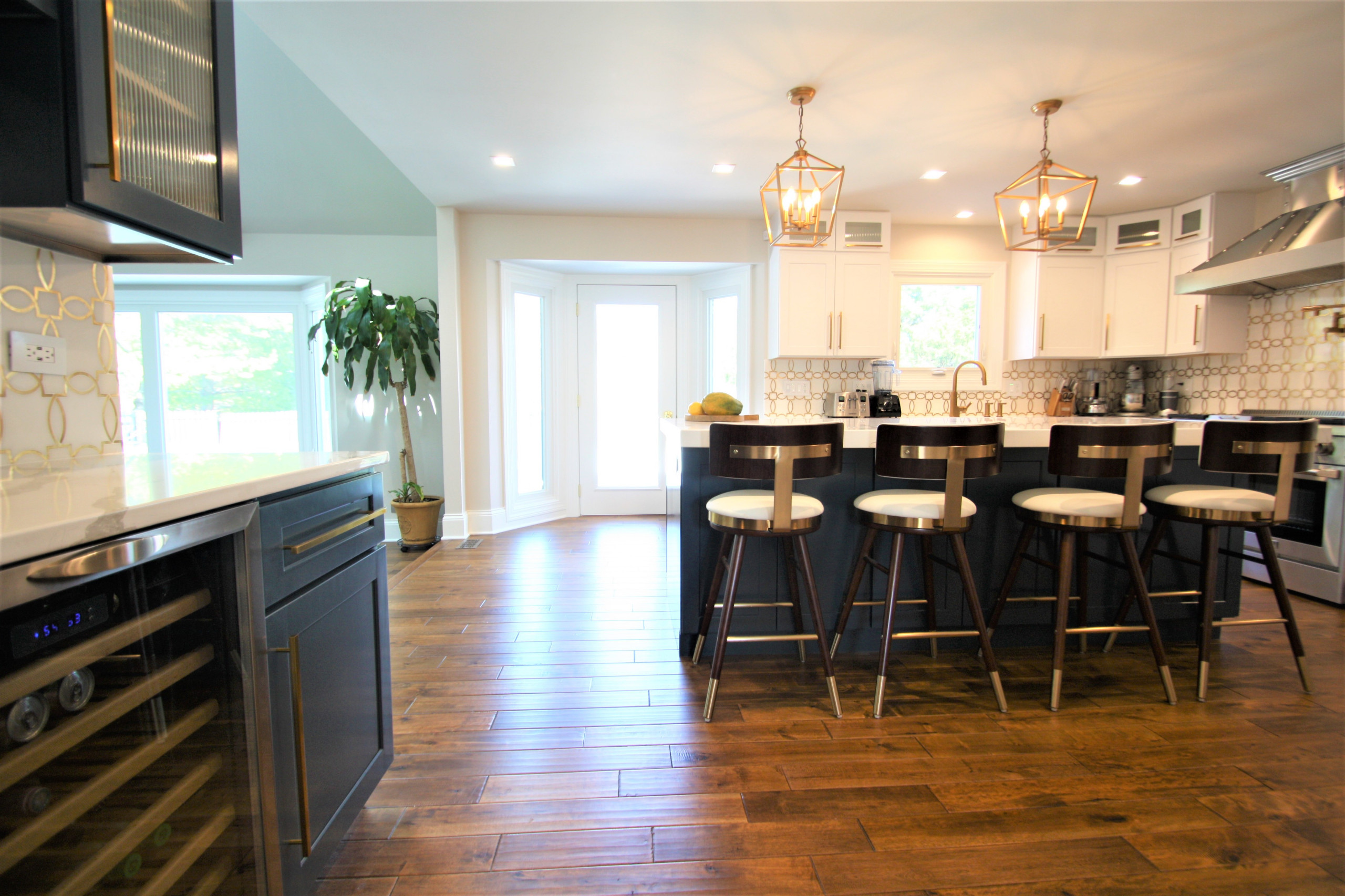 Modern kitchen design and remodel. Shaker style cabinets in white and blue.