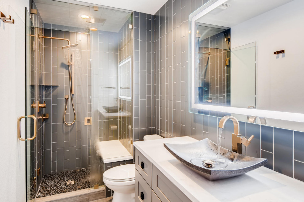This is an example of a mid-sized transitional 3/4 bathroom in Denver with shaker cabinets, white cabinets, an open shower, gray tile, ceramic tile, grey walls, a vessel sink, engineered quartz benchtops, a hinged shower door, white benchtops, a shower seat, a single vanity and a built-in vanity.