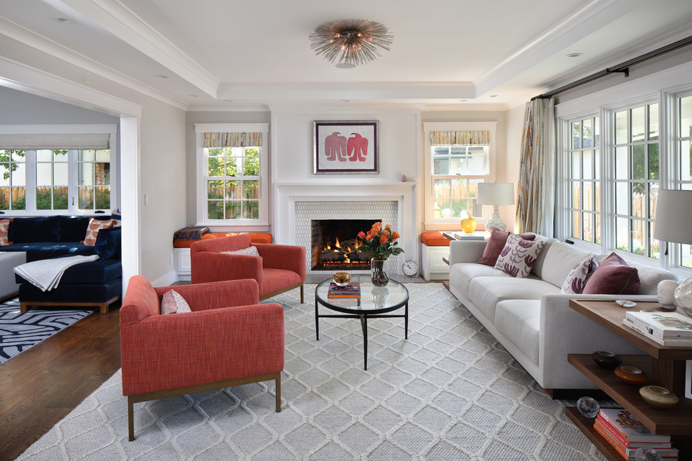 Design ideas for a large midcentury formal living room in San Francisco with dark hardwood floors, a standard fireplace, a tile fireplace surround, no tv and grey walls.