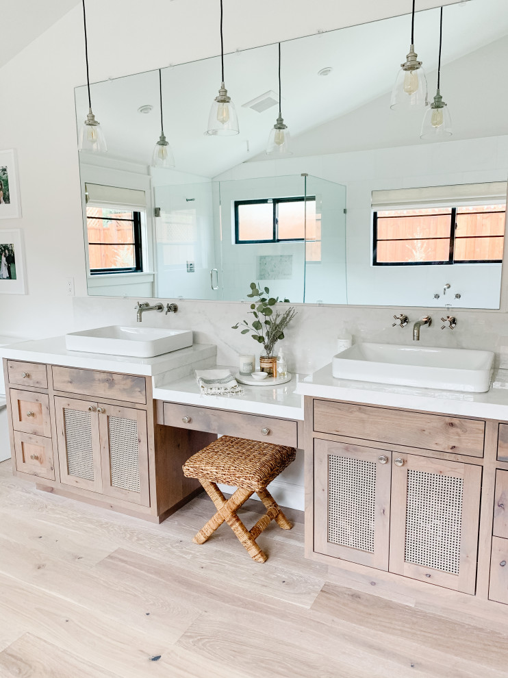 Design ideas for a mid-sized country master bathroom in San Francisco with medium wood cabinets, a freestanding tub, white tile, a double vanity, a built-in vanity and vaulted.