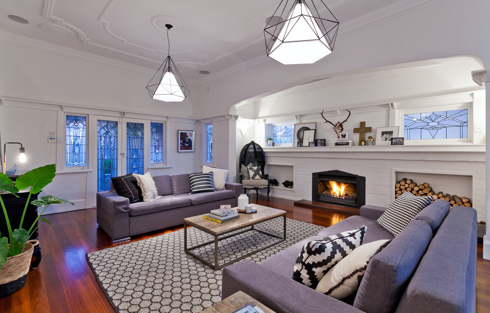 Design ideas for a transitional formal living room in Perth with white walls, dark hardwood floors, a standard fireplace and a brick fireplace surround.