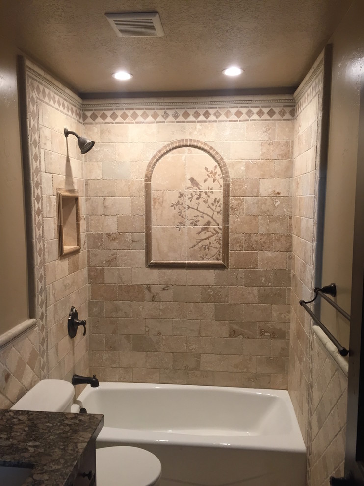 This is an example of a small country bathroom in Salt Lake City with brown cabinets, a two-piece toilet, stone tile, limestone floors and marble benchtops.