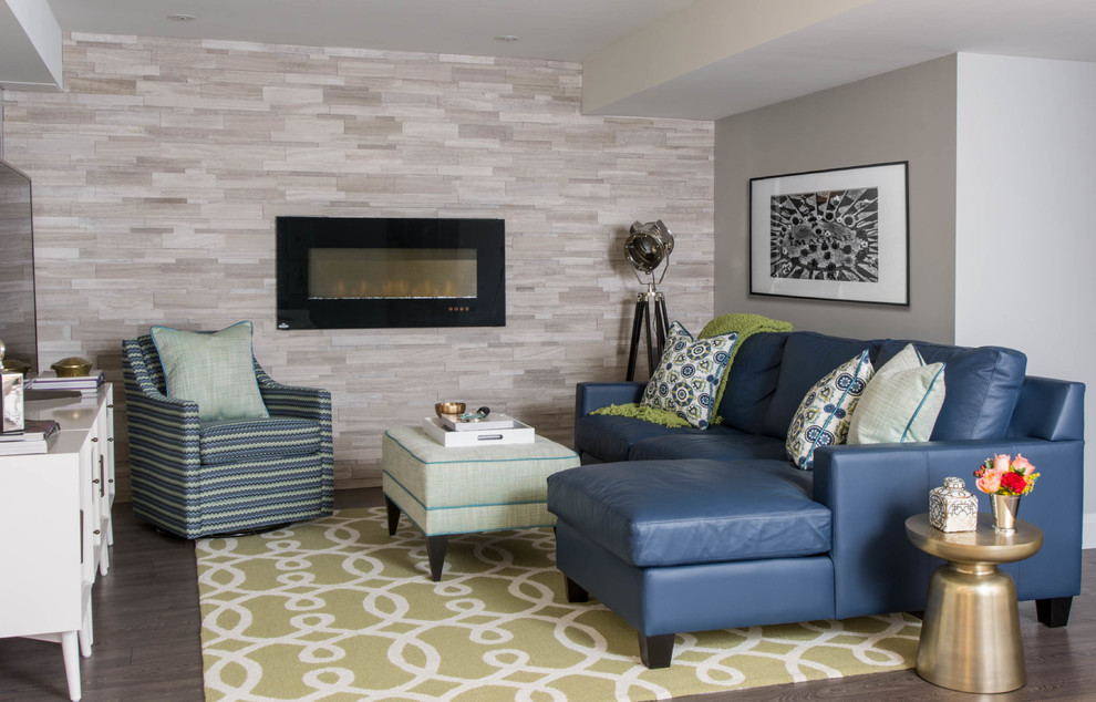 This is an example of a transitional family room in Toronto with grey walls, dark hardwood floors, a ribbon fireplace and a tile fireplace surround.