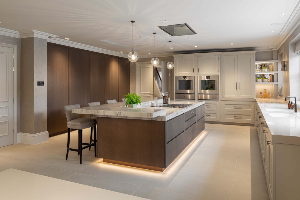 Large modern eat-in kitchen in London with a double-bowl sink, open cabinets, dark wood cabinets, marble benchtops, marble splashback, coloured appliances, ceramic floors, a peninsula, beige floor and white benchtop.