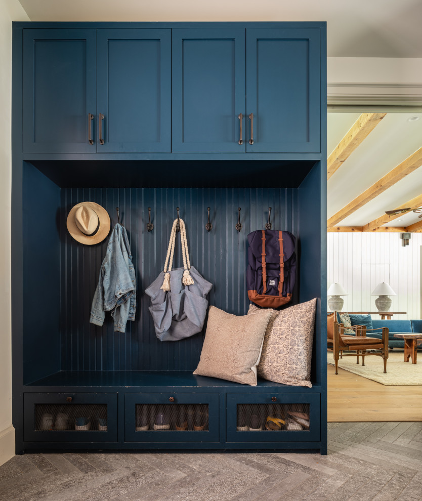 Farmhouse gray floor mudroom photo in Austin with beige walls