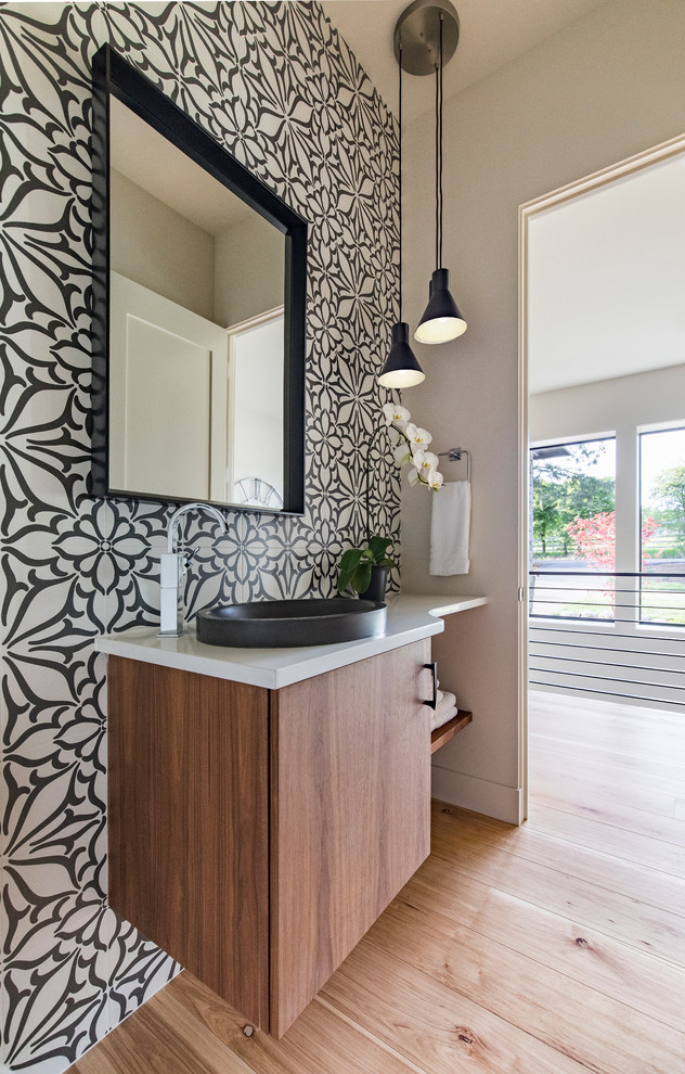 Design ideas for a contemporary bathroom in Portland with medium wood cabinets, black and white tile, medium hardwood floors, a vessel sink, quartzite benchtops, brown floor, white benchtops, flat-panel cabinets and green walls.
