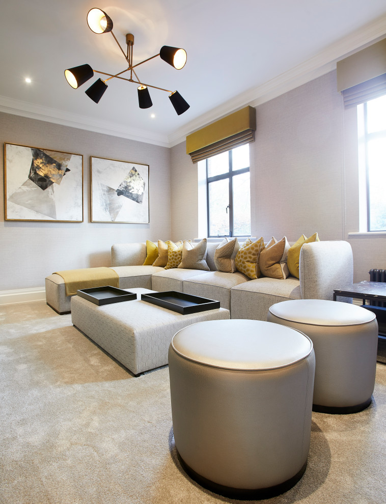 Inspiration for a small modern enclosed home theatre in Cheshire with beige walls, carpet, a built-in media wall and beige floor.