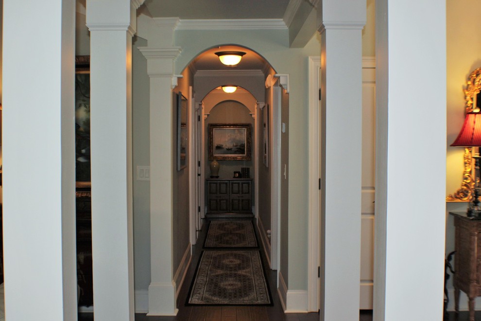 Design ideas for a mid-sized traditional hallway in Atlanta with blue walls and dark hardwood floors.