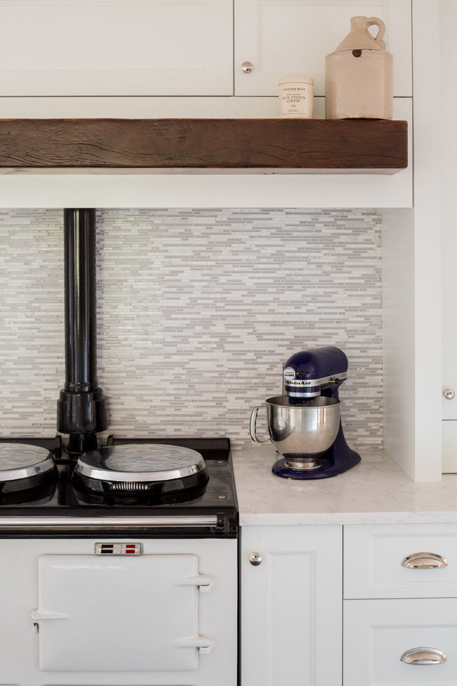 Example of a transitional kitchen design in Toronto