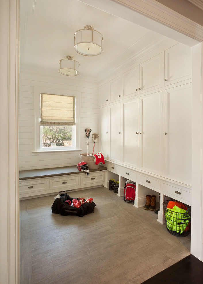 Photo of a large traditional mudroom in New York.
