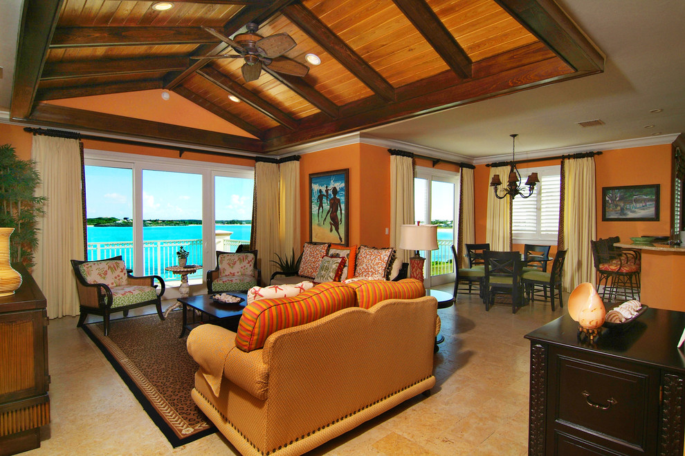 Inspiration for a tropical open concept family room in Denver with orange walls.