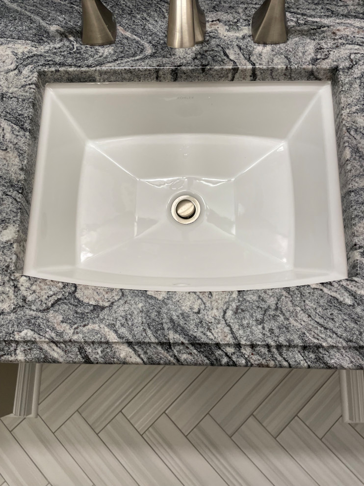 Example of a transitional bathroom design in Omaha with gray walls, a drop-in sink and marble countertops