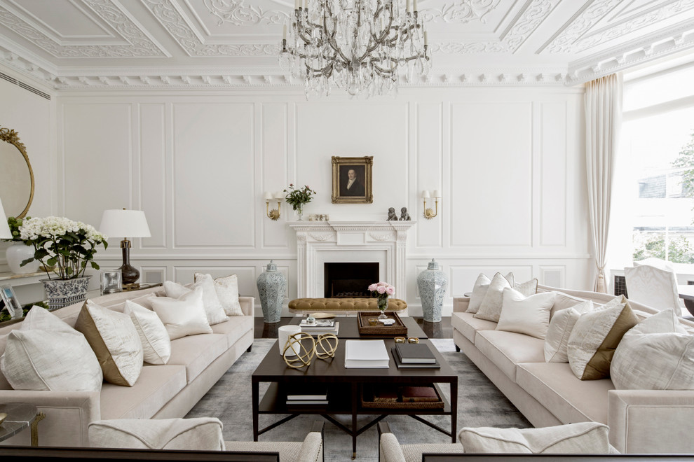 Design ideas for a large traditional formal open concept living room in London with white walls, a standard fireplace, a plaster fireplace surround and no tv.