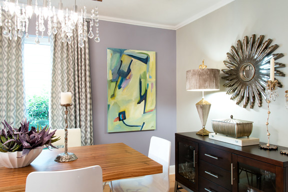 Dining room - large modern medium tone wood floor dining room idea with purple walls