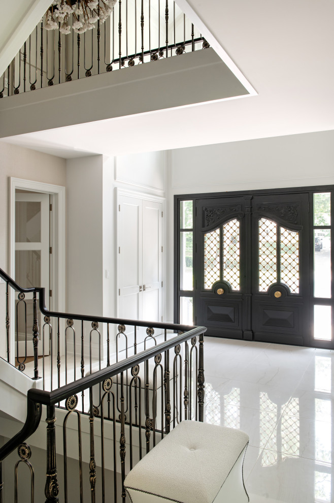 Inspiration for a large transitional porcelain tile and white floor front door remodel in Toronto with white walls and a black front door