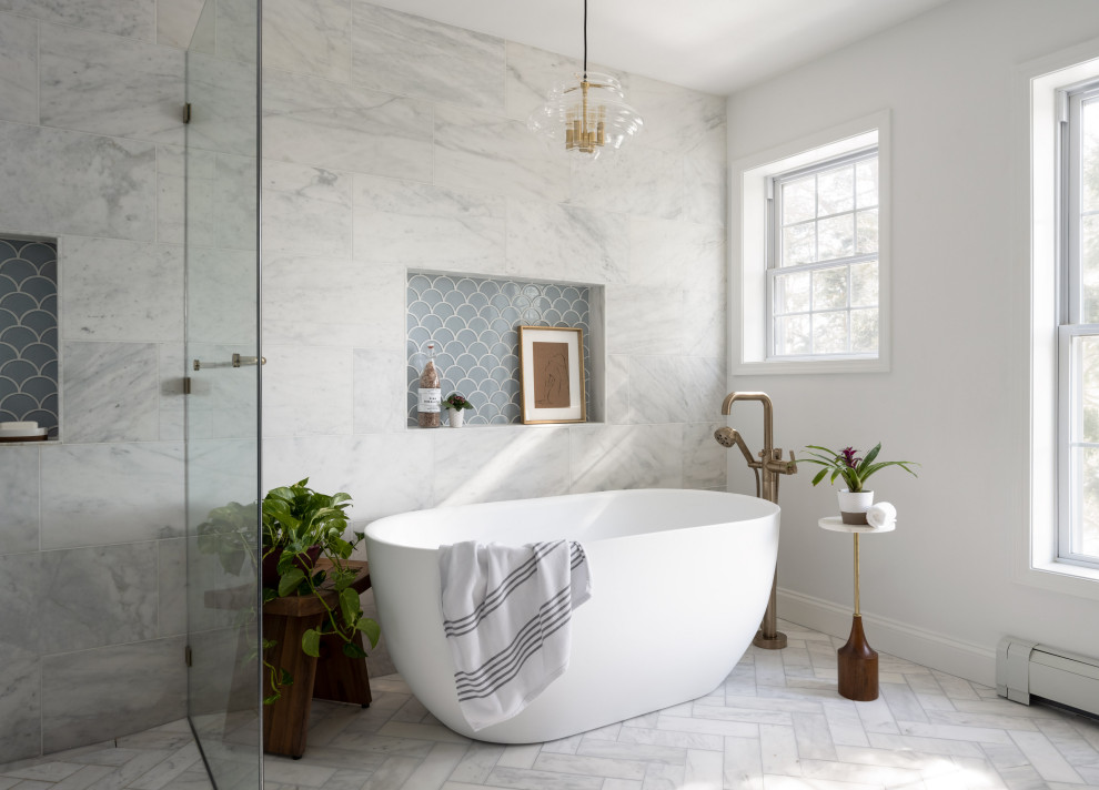 Design ideas for a large master bathroom in Boston with blue cabinets, a freestanding tub, a curbless shower, a bidet, marble, grey walls, marble floors, an undermount sink, engineered quartz benchtops, white floor, a hinged shower door, white benchtops, a niche and a double vanity.