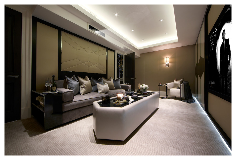 This is an example of a medium sized classic home cinema in London with green walls, carpet, a built-in media unit and grey floors.