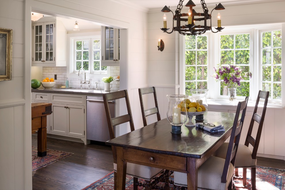 Photo of a mid-sized traditional kitchen/dining combo in Orange County with dark hardwood floors and white walls.