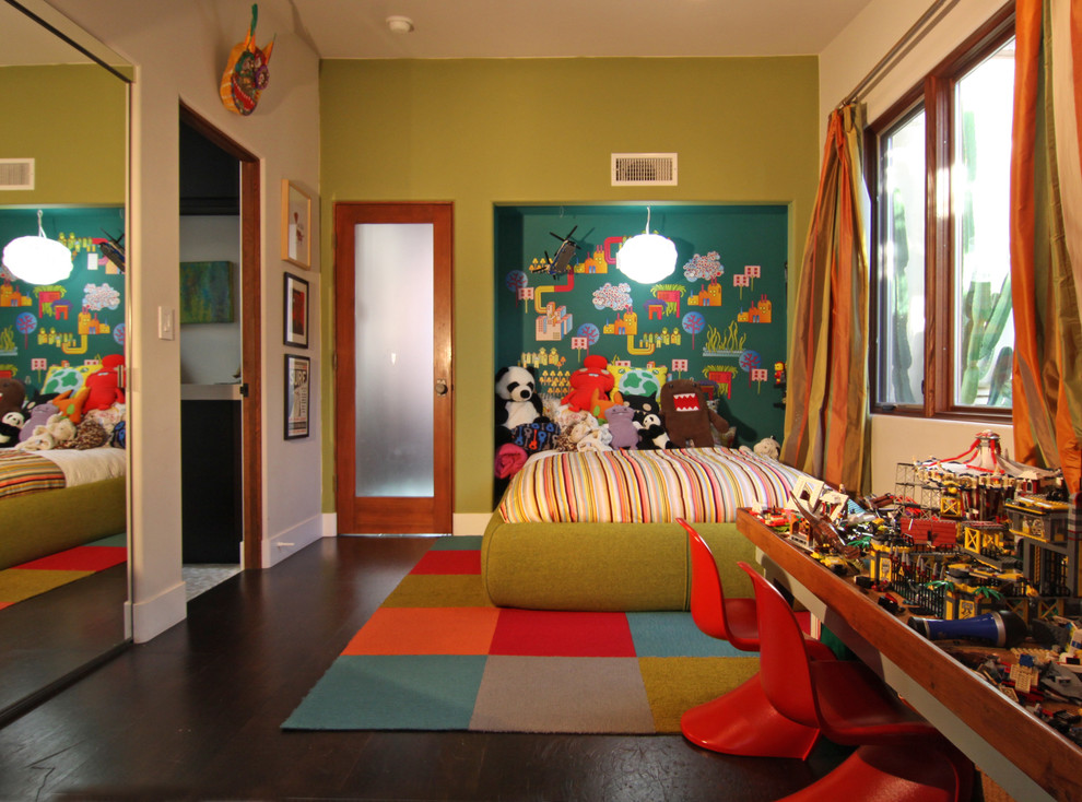 Eclectic gender-neutral kids' room in San Diego with dark hardwood floors and multi-coloured walls.