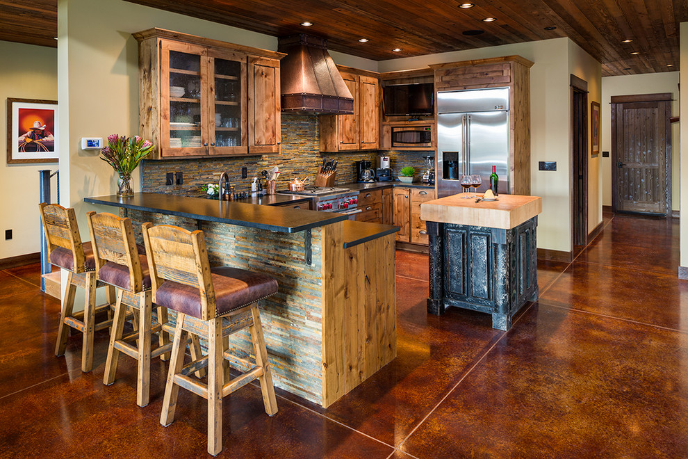 Example of a mountain style concrete floor kitchen design
