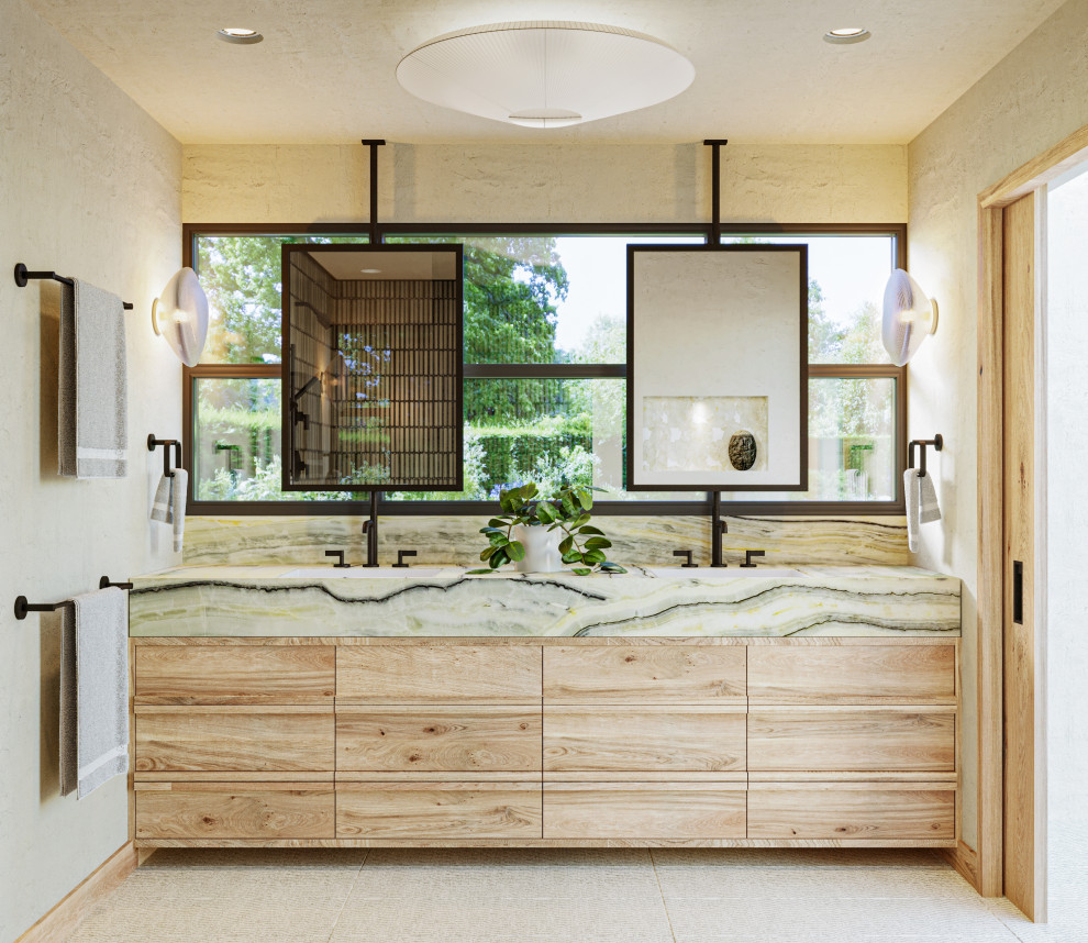 Inspiration for a large scandinavian master bathroom in Los Angeles with furniture-like cabinets, light wood cabinets, a freestanding tub, an open shower, a wall-mount toilet, green tile, ceramic tile, white walls, limestone floors, an undermount sink, onyx benchtops, white floor, an open shower, green benchtops, a niche, a double vanity and a floating vanity.
