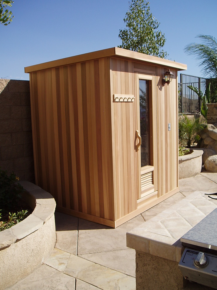 Photo of a mid-sized contemporary bathroom in Los Angeles with brown walls, medium hardwood floors, with a sauna and brown floor.