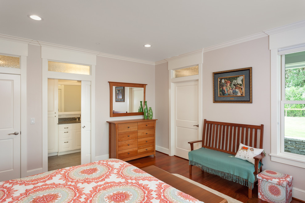 Design ideas for a mid-sized traditional guest bedroom in Other with beige walls and dark hardwood floors.