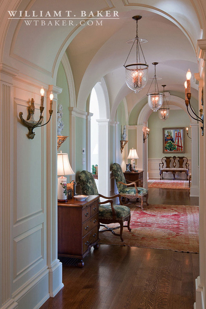 Design ideas for a large traditional hallway in Louisville with green walls and dark hardwood floors.