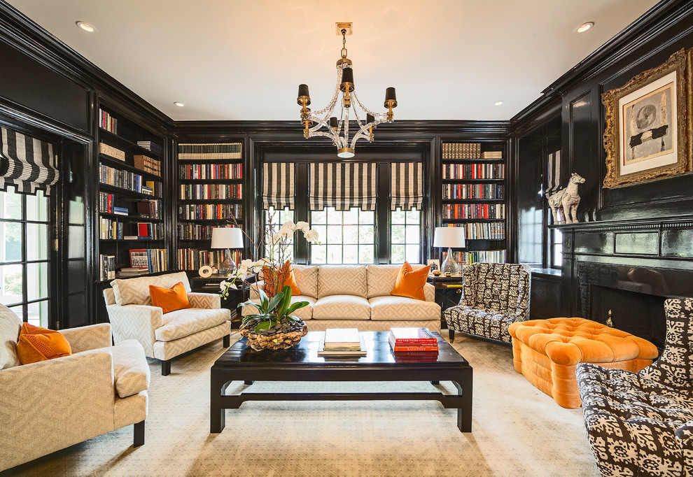 Inspiration for a traditional family room in Raleigh with black walls.