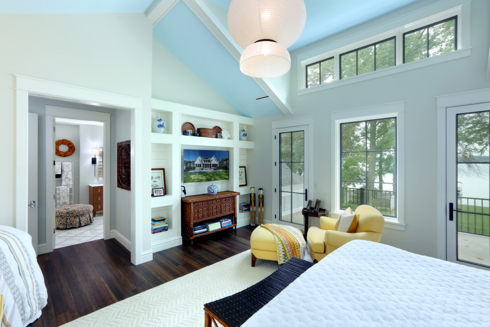 This is an example of a mid-sized country master bedroom in Grand Rapids with dark hardwood floors and grey walls.