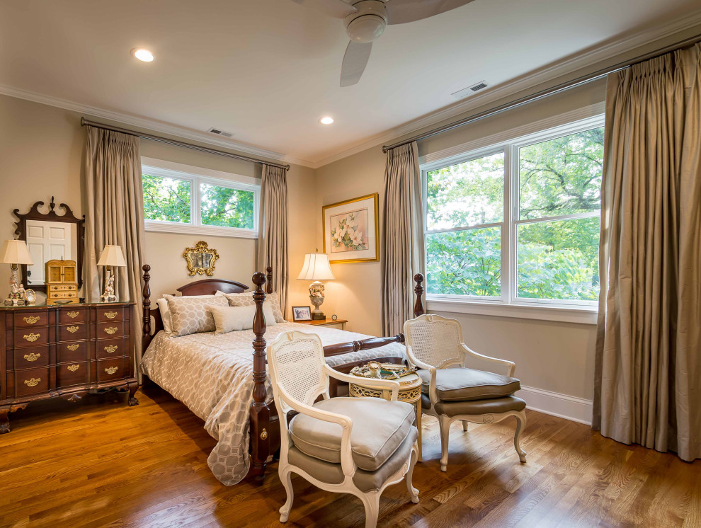 This is an example of a mid-sized traditional master bedroom in Chicago with beige walls, light hardwood floors, no fireplace, brown floor, wallpaper and wallpaper.