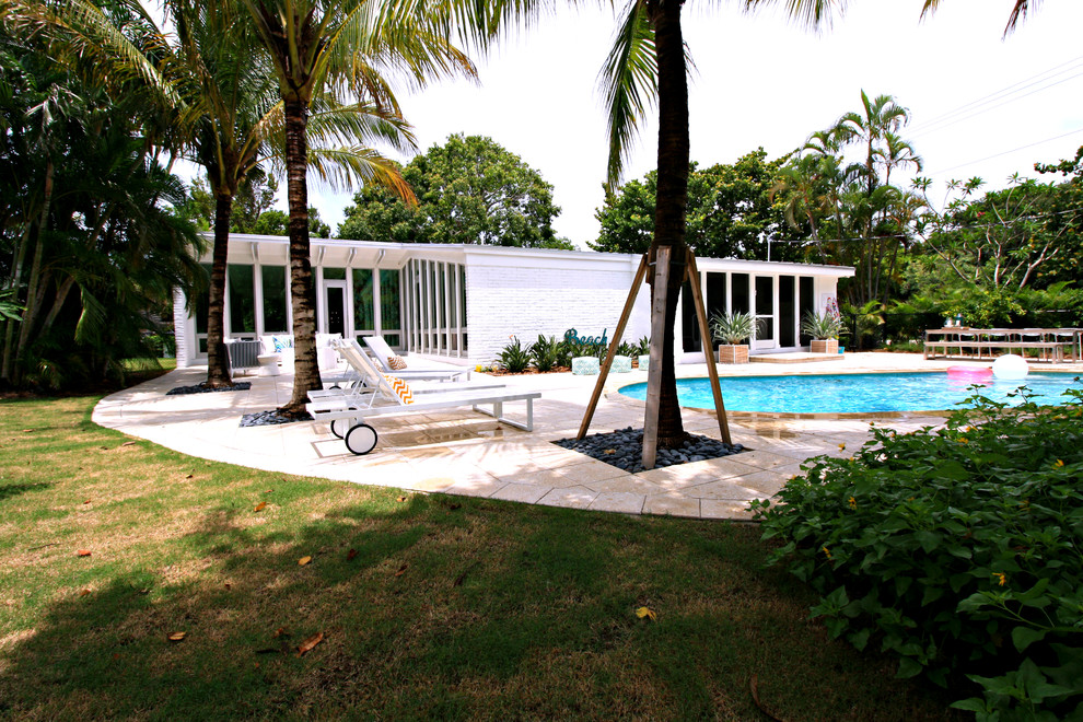 This is an example of a beach style pool in Miami.