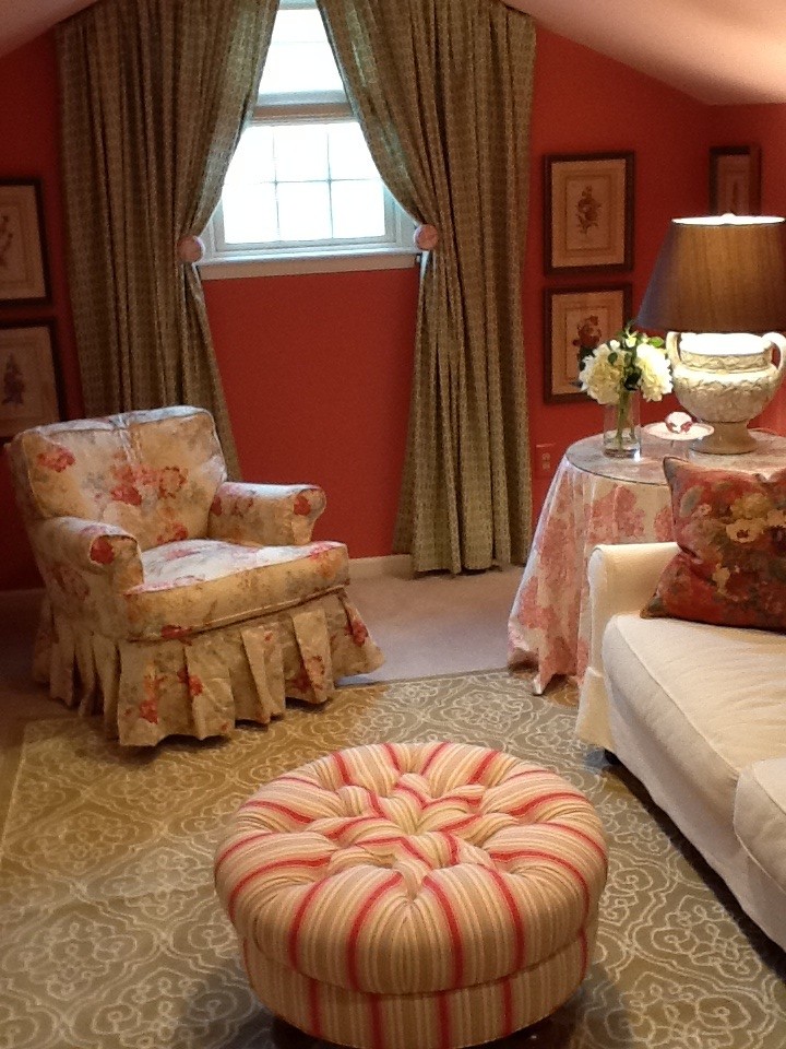This is an example of a small traditional formal enclosed living room in Philadelphia with orange walls, carpet, no fireplace, no tv and beige floor.