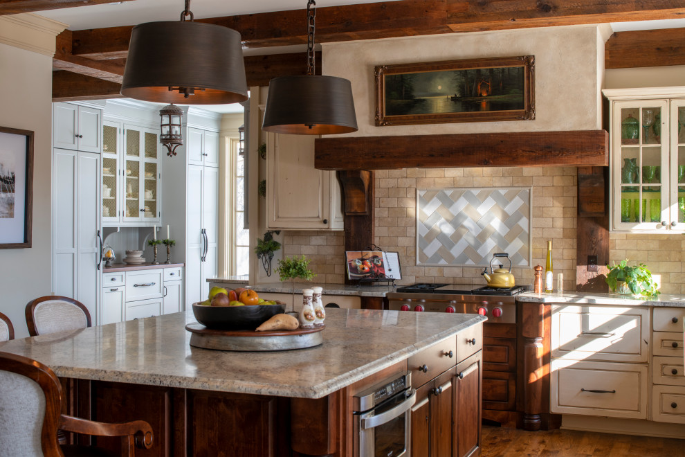 Inspiration for a large french country l-shaped medium tone wood floor, brown floor and exposed beam kitchen pantry remodel in Minneapolis with a farmhouse sink, recessed-panel cabinets, blue cabinets, granite countertops, beige backsplash, ceramic backsplash, stainless steel appliances, an island and beige countertops