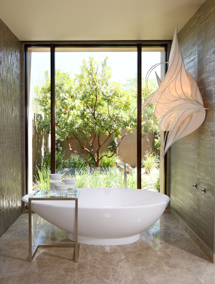 Large contemporary 3/4 bathroom in Las Vegas with a freestanding tub and marble floors.