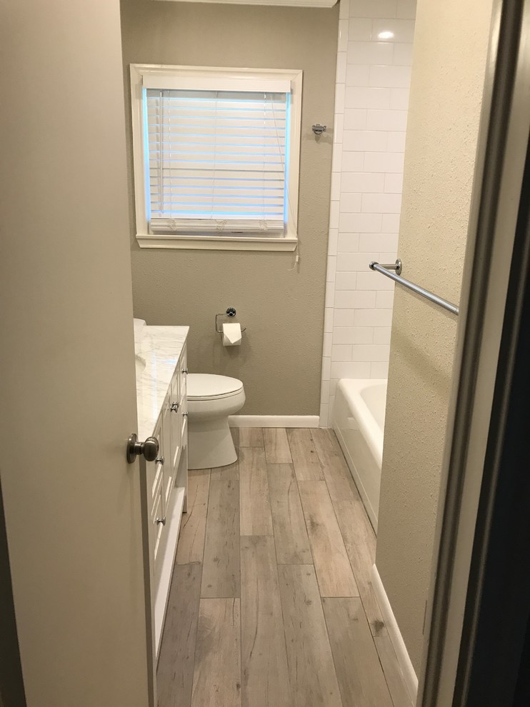 Photo of a small contemporary kids bathroom in Dallas with a two-piece toilet, quartzite benchtops and multi-coloured floor.