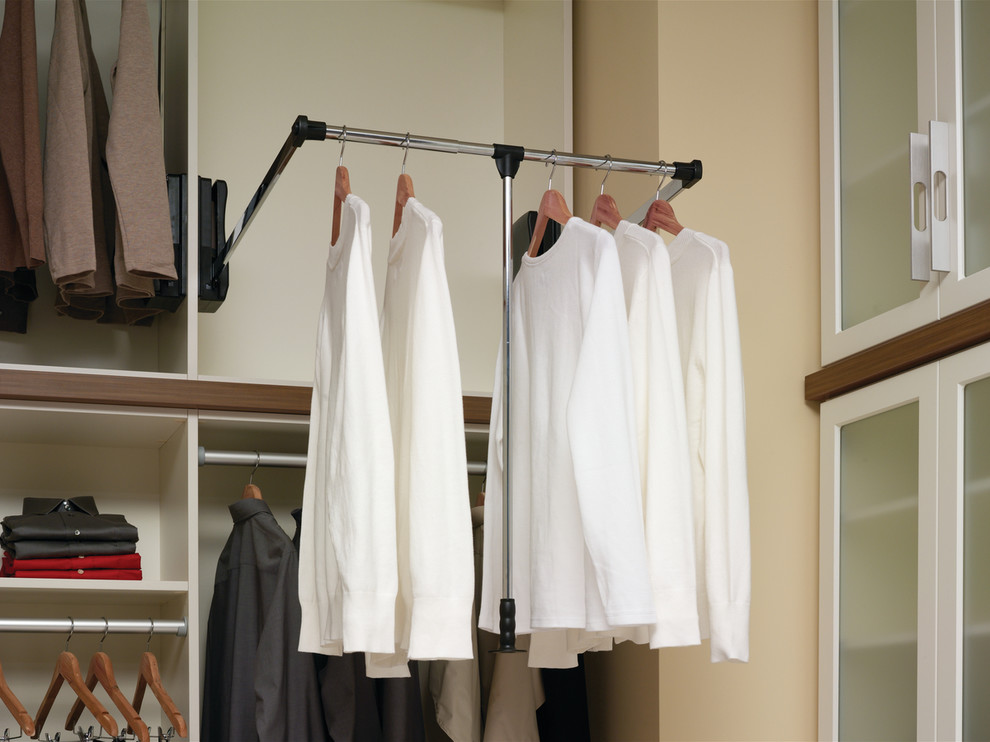This is an example of a small traditional gender-neutral walk-in wardrobe in New York with open cabinets.