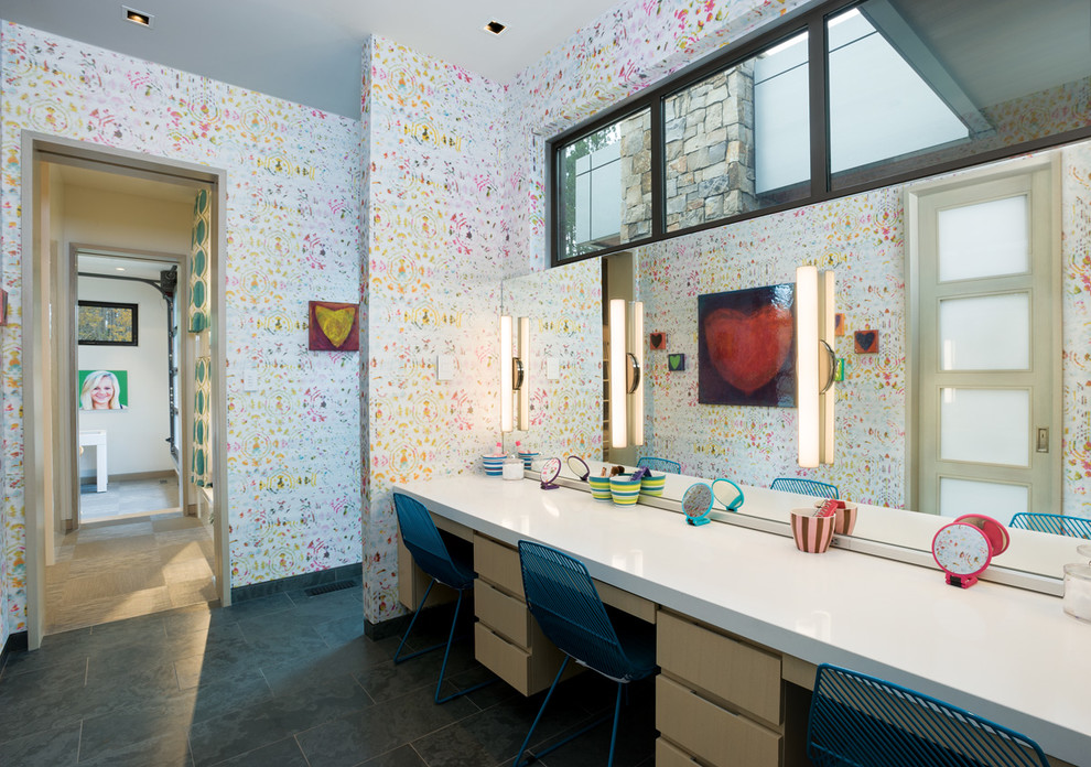 This is an example of a large contemporary kids' room in Seattle with multi-coloured walls and ceramic floors.