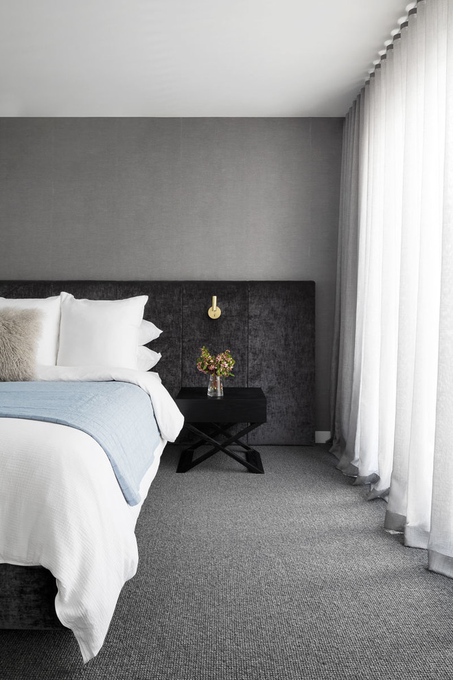 Inspiration for a contemporary master bedroom in Melbourne with carpet and grey floor.