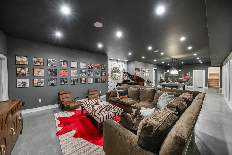 This is an example of a contemporary walk-out basement in New York with grey walls, concrete floors, no fireplace and grey floor.