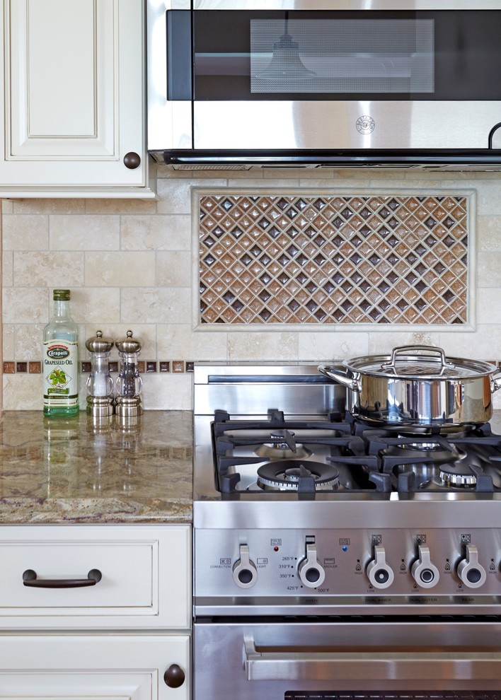 Example of a small classic l-shaped medium tone wood floor eat-in kitchen design in Chicago with a double-bowl sink, raised-panel cabinets, white cabinets, quartz countertops, beige backsplash, stone tile backsplash, stainless steel appliances and no island
