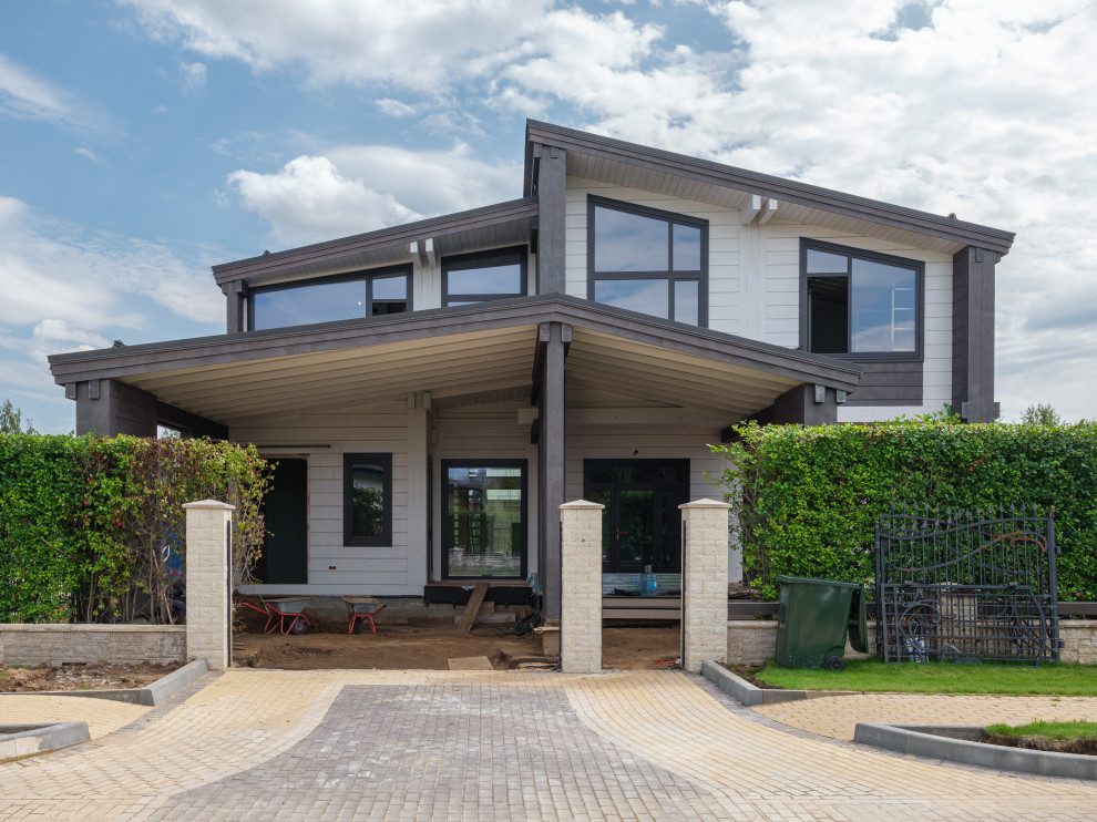 Трапецевидные окна, порталы и входные двери для современного дома