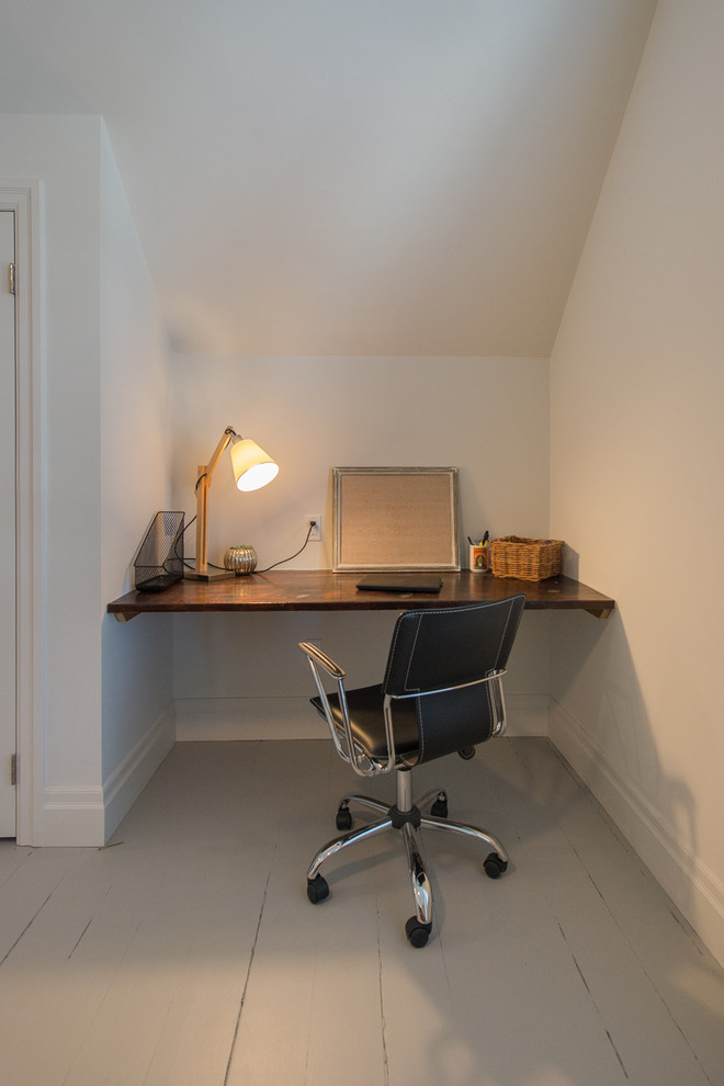 Mid-sized transitional home office in Toronto with white walls, painted wood floors, no fireplace and grey floor.