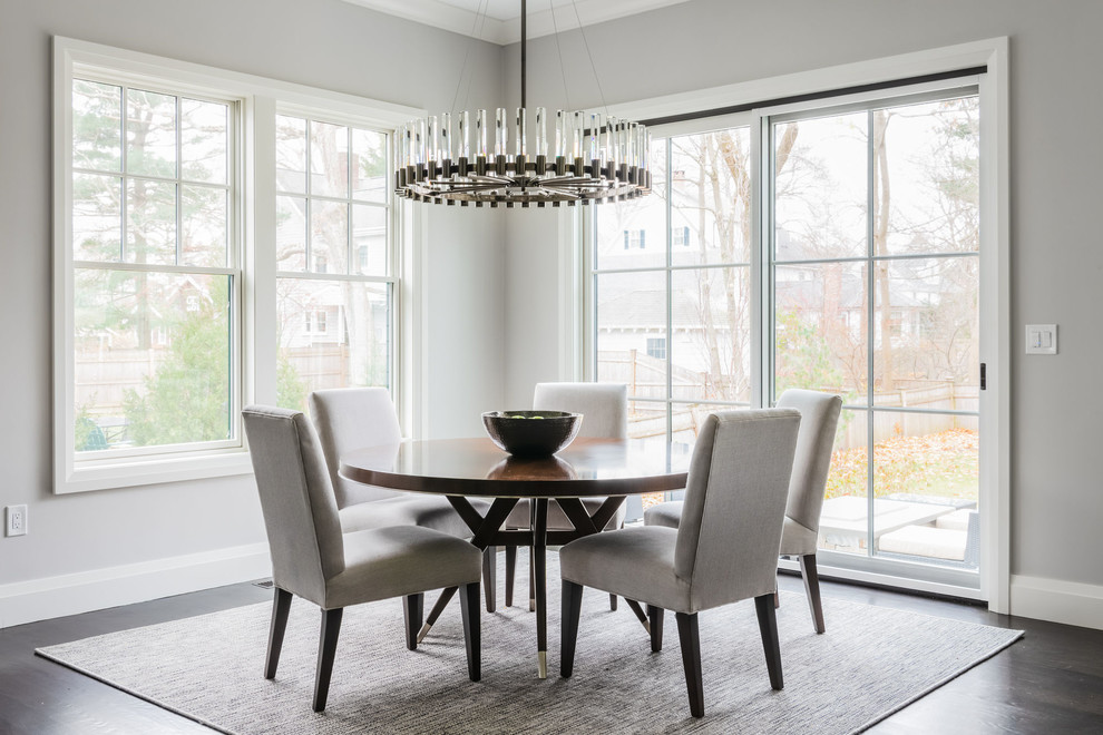 Mid-sized transitional open plan dining in Boston with grey walls, dark hardwood floors, no fireplace and brown floor.