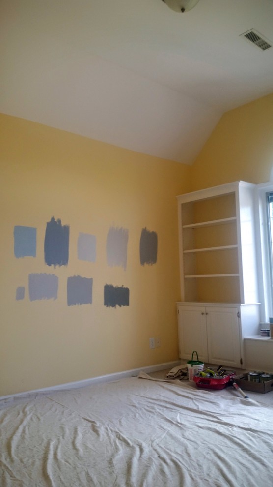Mid-sized contemporary nursery in Boston with yellow walls.