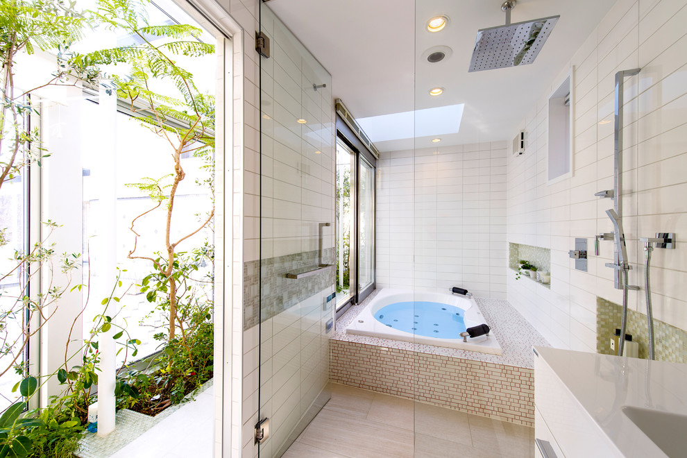 Modern bathroom with white tile, porcelain tile, white walls, porcelain floors and beige floor.
