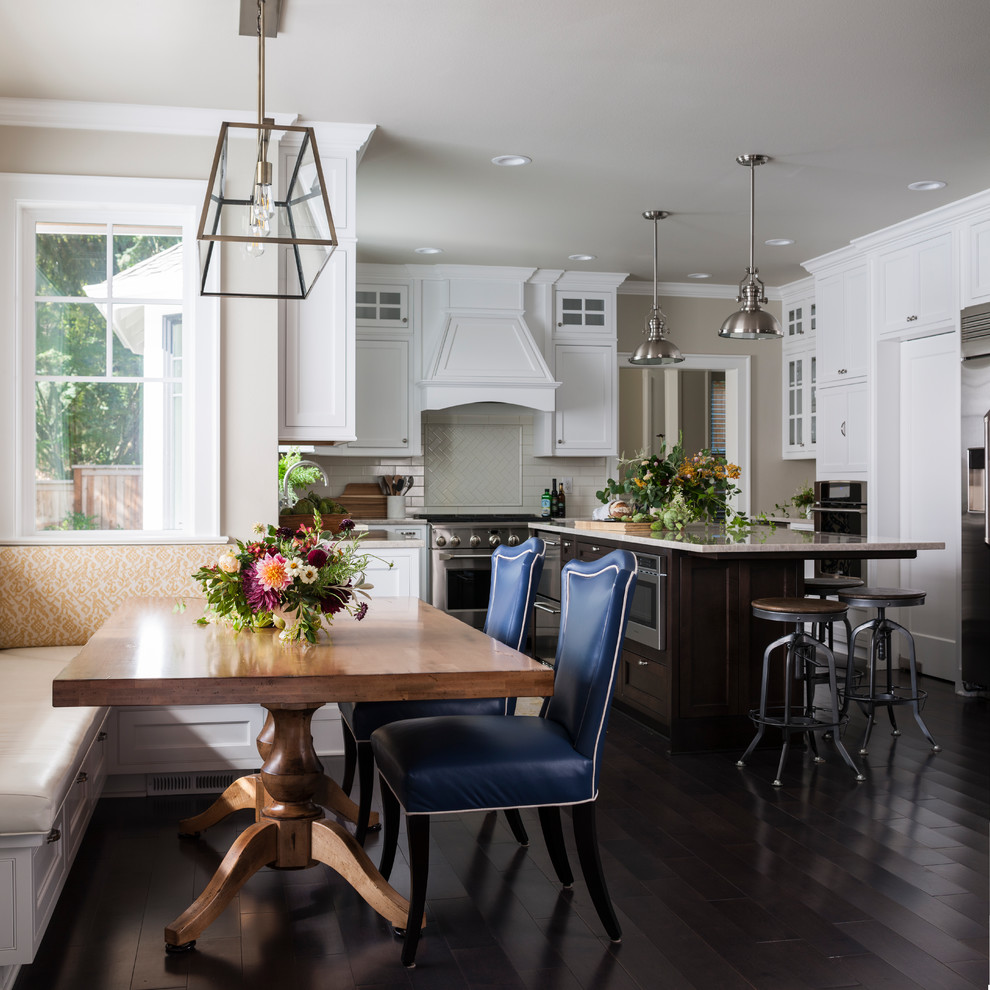Inspiration for a large transitional kitchen/dining combo in Seattle with dark hardwood floors, brown floor and beige walls.