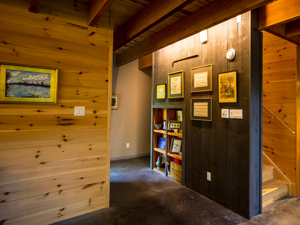 Mid-sized mountain style concrete floor and gray floor foyer photo in Ottawa with brown walls and a red front door