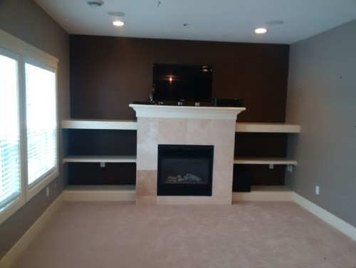 Fireplace mantel is too deep! We want to be able to put our tv on top of the mantel on a bracket so it lowers down over the fireplace...however the mantel is not flush with the wall