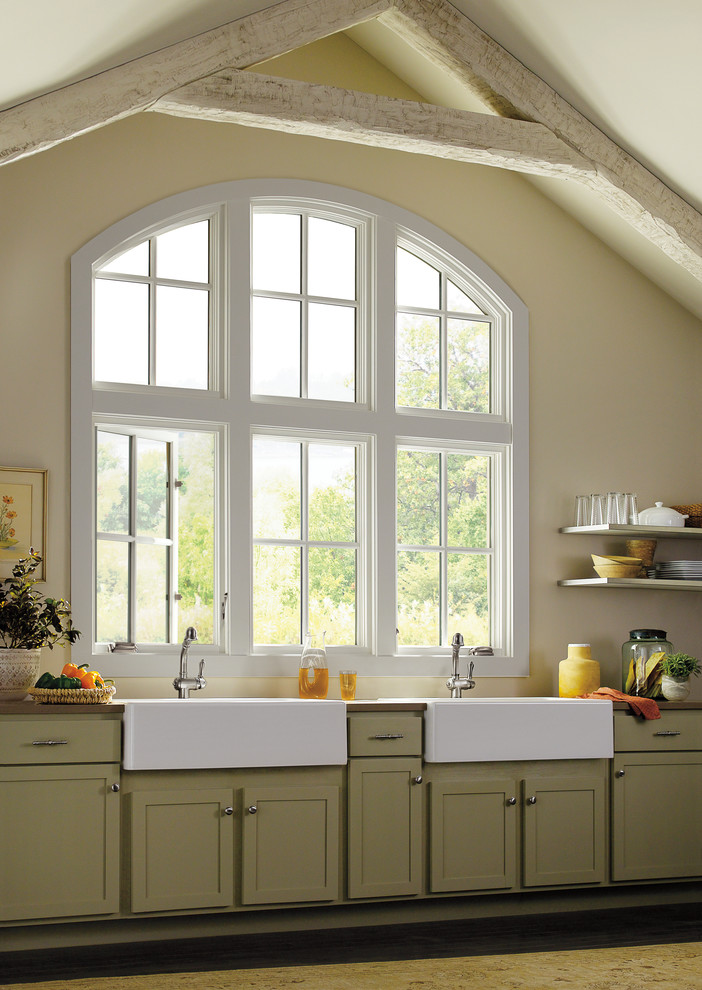 Inspiration for a transitional single-wall kitchen remodel with a farmhouse sink, green cabinets and no island